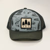 Trucker hat with nature-themed design on a white background