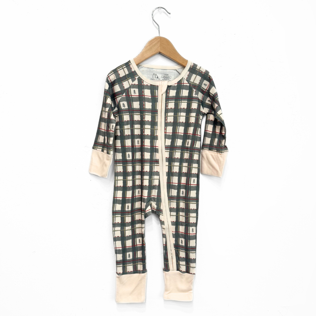 Plaid baby onesie on a hanger against a white background