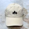 Cream dad hat with embroidered three-tree design