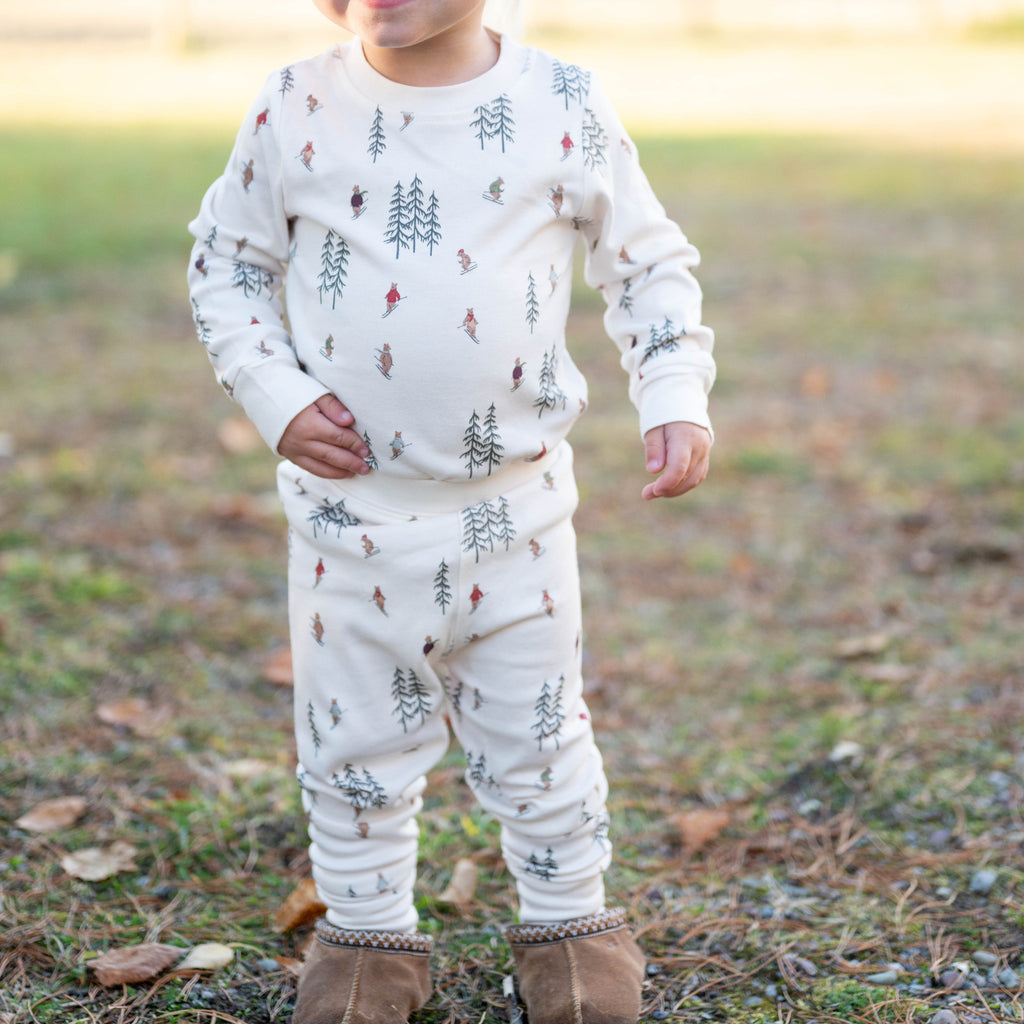 Child wearing skiing bear pajamas