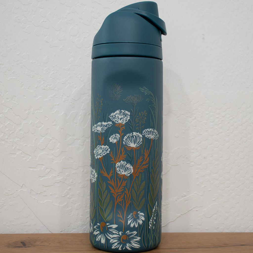 Teal water bottle with floral design 